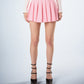 Bella Pink Pleated Mini Skirt model front