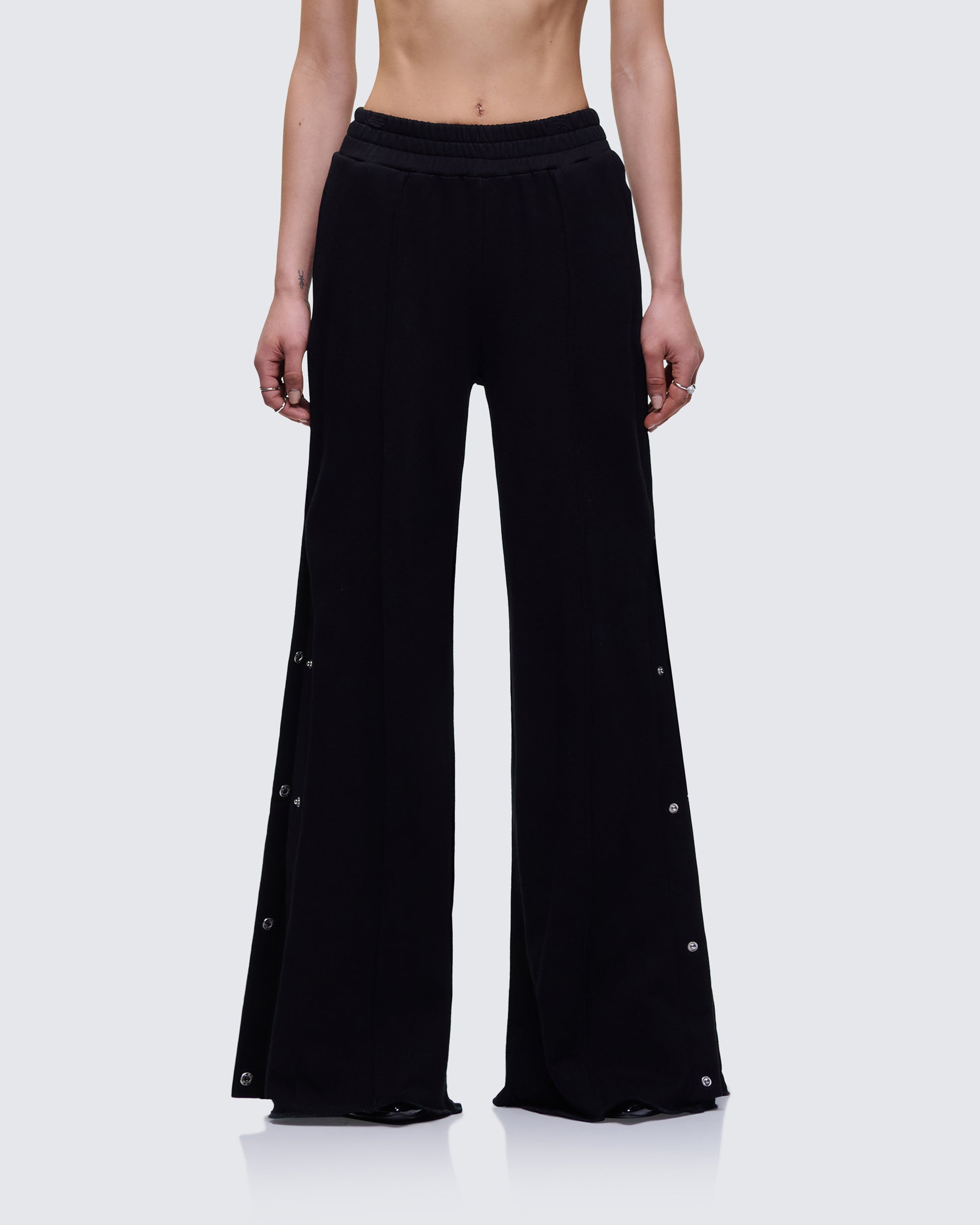 Saige Black Popper Detail Loose Sweatpant model front