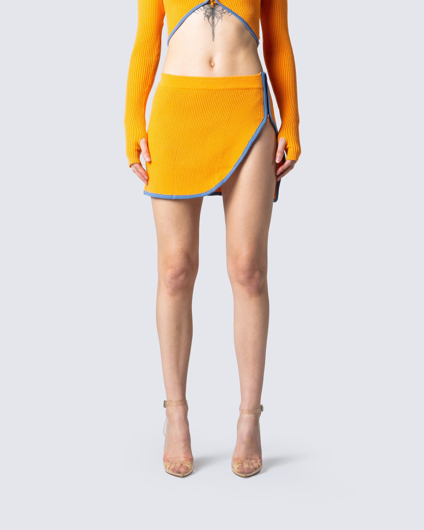 Riley Orange Mini Skirt model front